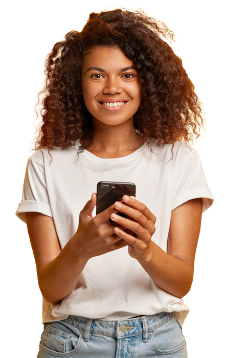 African American woman smiling while holding cell phone