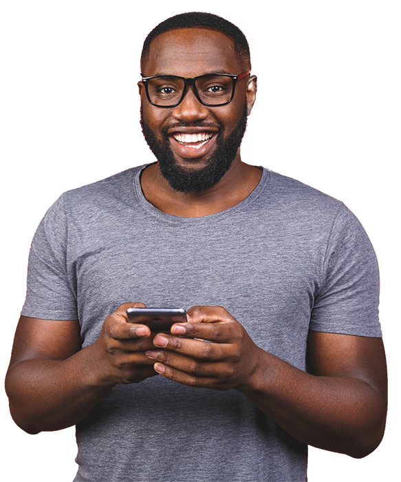 African American man smiling and holding a cell phone