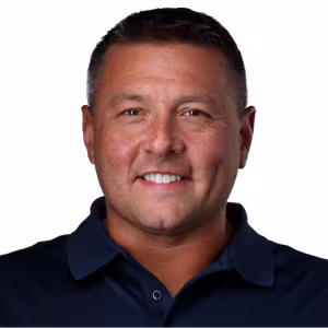 headshot of Andy Zemon, wearing a black polo