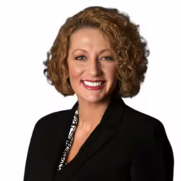 headshot of Brandi McEwen, weaing a black blazer