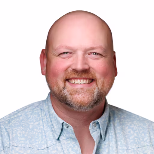 headshot of Chris Hoehn, wearing a partnered light blie polo