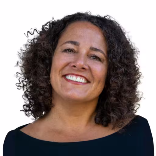 Headshot of Dee Cayo, wearing a black shirt.