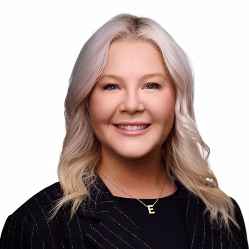 headshot of Erin Waddell, wearing a black sweater