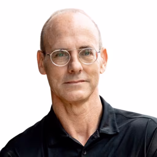 headshot of Glen Bremer, wearing a black polo