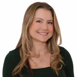 Headshot of Haley Pietraniec wearing black shirt with white background
