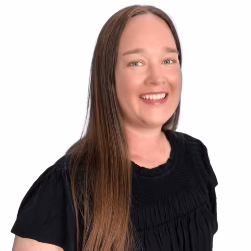 Headshot of Jen Duggan wearing black shirt with white background