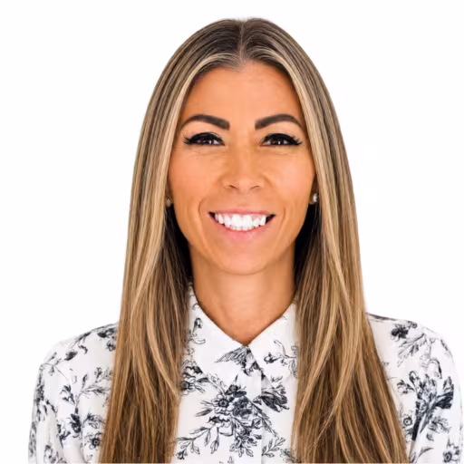 headshot of Jenna Gonzalez, wearing a black and white printed blouse