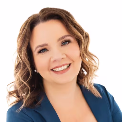 headshot of Jennifer Van Valzah, wearing a blue blazer