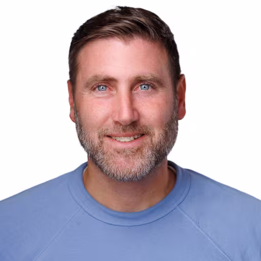 Headshot of Jesse DeJacimo, wearing a light blue sweater