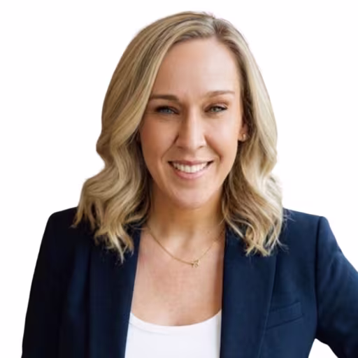 headshot of Jocelyn Jackson, wearing a dark blue blazer and white shirt