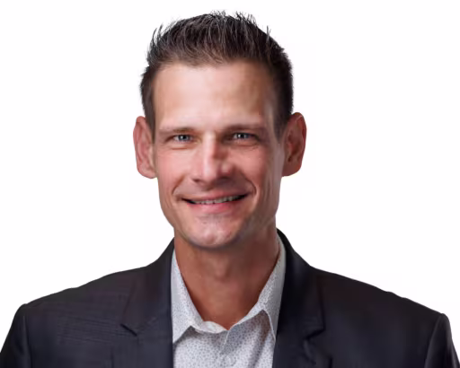 headshot of Jon Rishel, wearing a black suit