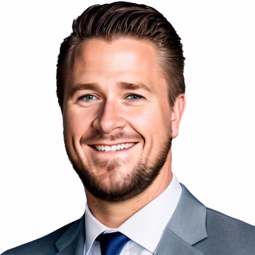 headshot of Jordan Leonhard, wearing a grey suit