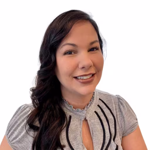 headshot of Kari Pastrana, wearing a grey shirt