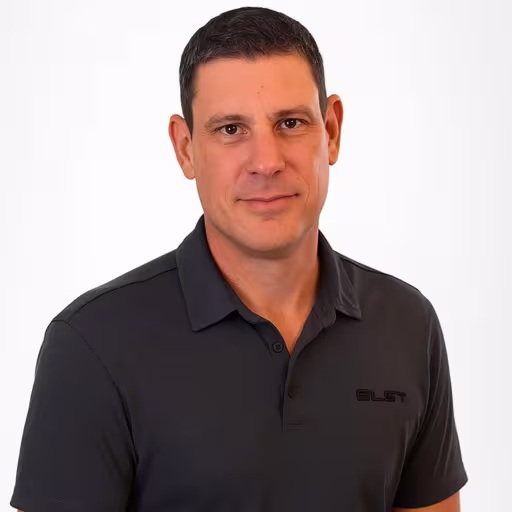 headshot of Karl Hoeferlin, wearing a dark grey polo