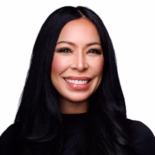 headshot of Katy Igarta, wearing a black turtle neck