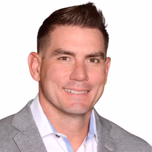 headshot of Matthew Potter, wearing a grey suit and a white shirt