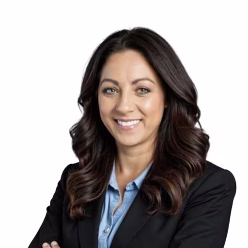 headshot of Misty Canipe, wearing a black blazer with a blue shirt