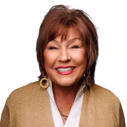 Headshot of Neda Ward wearing white dress shirt and glittery gold blouse with white background