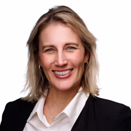 headshot of Rebekah Page, wearing a black blazer with a white blouse