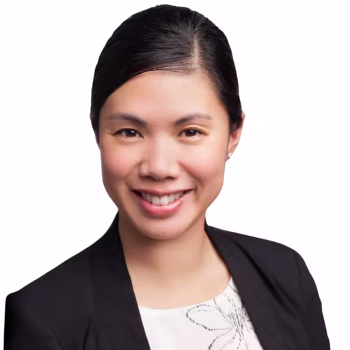 Headshot of Rosa Nguyen wearing white shirt and black suit coat with white background