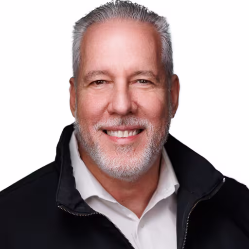 headshot for Ruben Garcia, wearing a black pull over with a white shirt