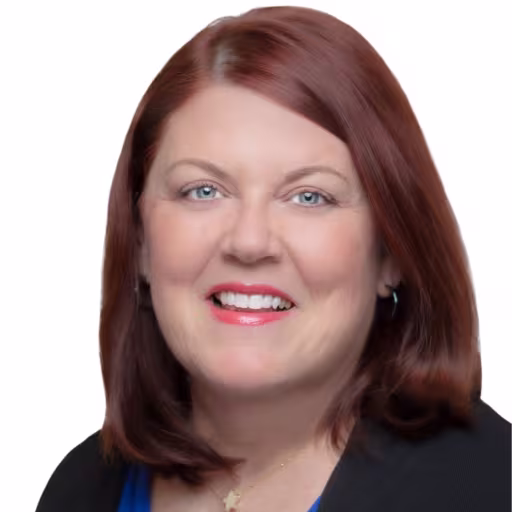 headshot of Susan Dewar, wearing a black shirt