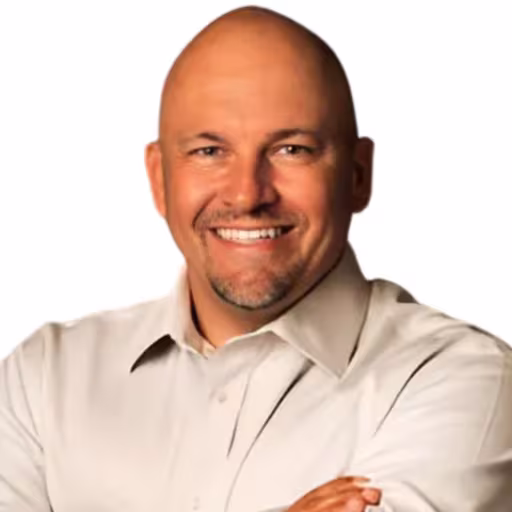 headshot of Thomas Faille, wearing a white shirt