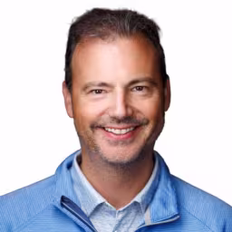 headshot of Thomas Fomenko, wearing a light blue pullover