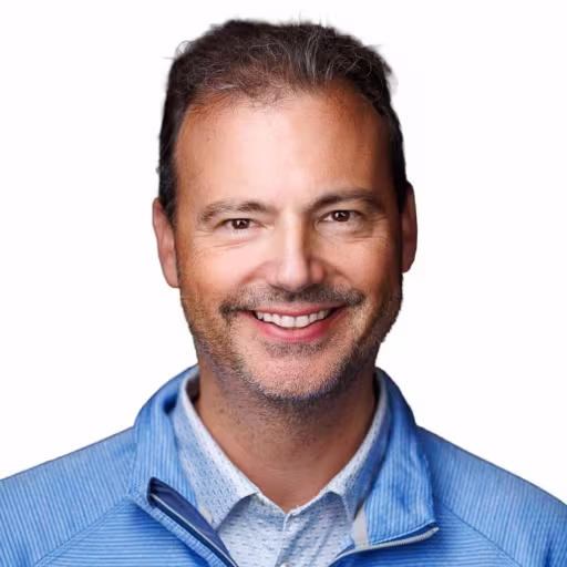 headshot of Thomas Fomenko, wearing a light blue pullover