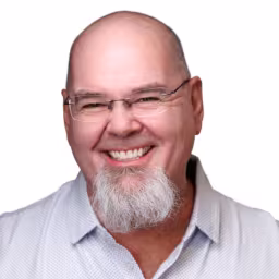 headshot of Tony Hunsinger, wearing a light blue polo