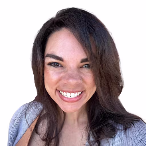 Headshot of Tori Mays wearing light blue sweater with white background
