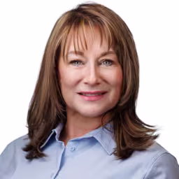 headshot of Wendy Rush, wearing a light blue shirt