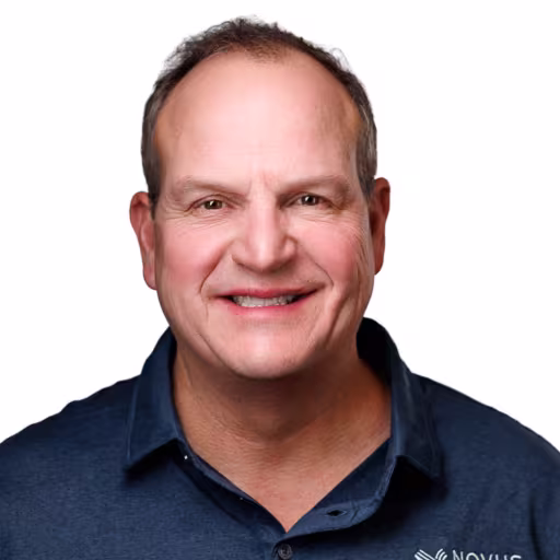 headshot for Rust Hilsman, wearing a dark blue polo