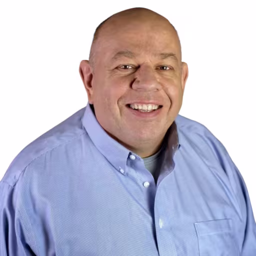 headshot of Stephen Johnson, wearing a blue button up