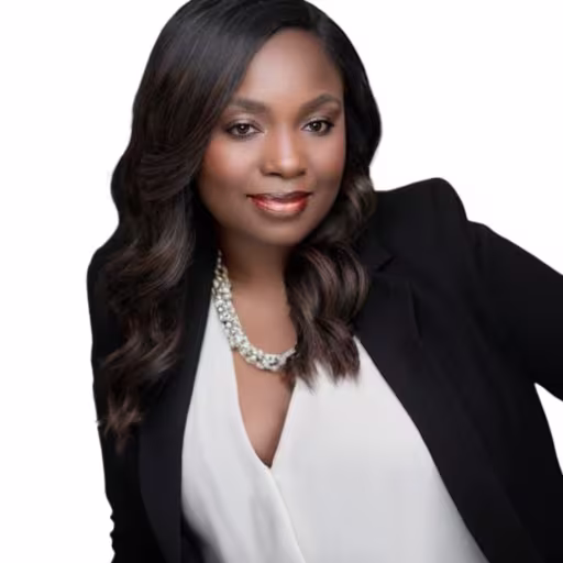 headshot of Tamairo Moutry, wearing a black blazer with a white blouse