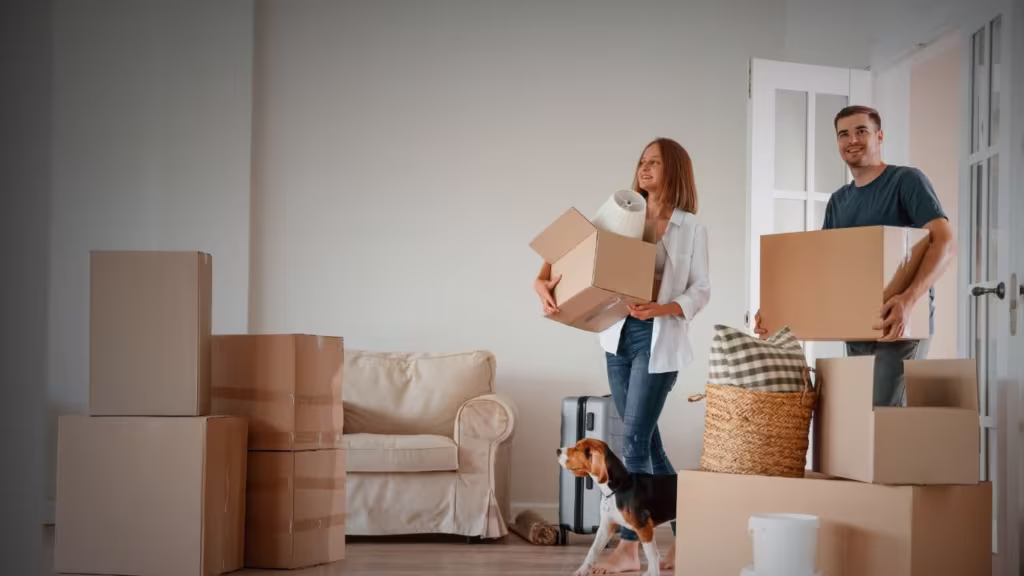 Young couple with dog are moving to new home
