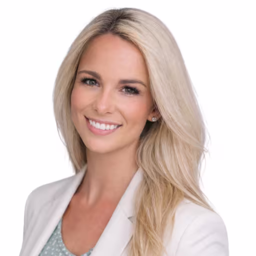 headshot of Jessica Leonhard, wearing a white blazer with a blue shirt