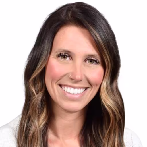Headshot of Cassi Bauer wearing white shirt with white background