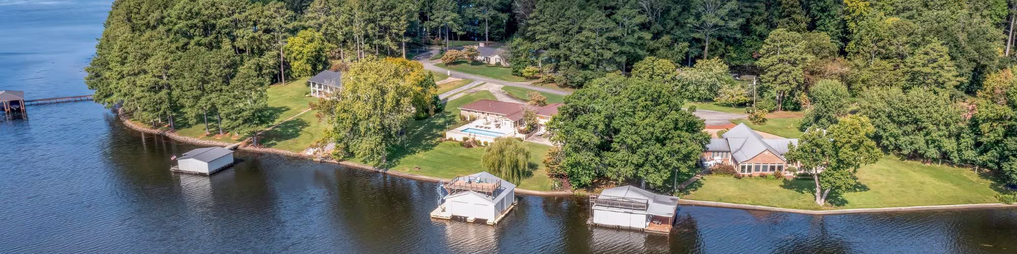 Aerial overhead view of lakefront homes and boat houses on Guntersville Lake in Scottsboro Alabama.