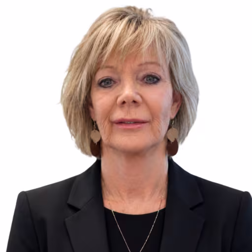 headshot of Sheyl Lindsay, wearing a black blazer and black shirt