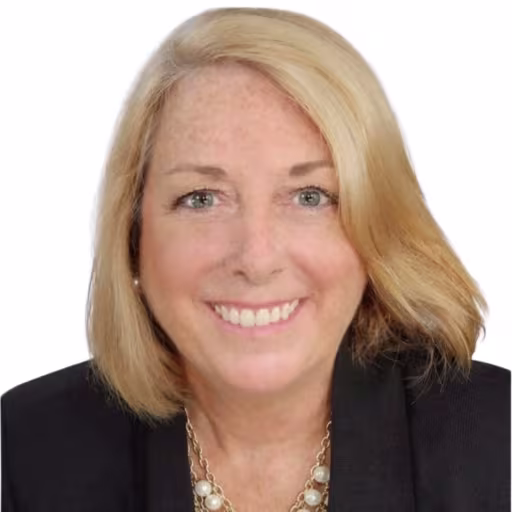 Headshot of Jeanne Seils wearing black overcoat