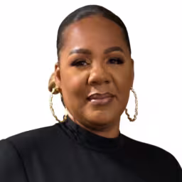 headshot of Karen Singleton, wearing a black turtleneck