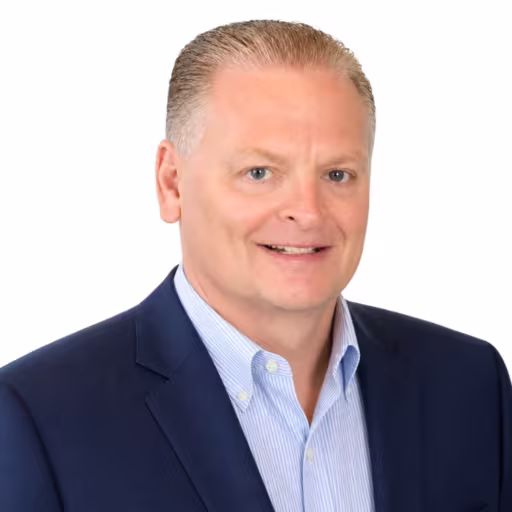 Man wearing a blue sports coat and button down