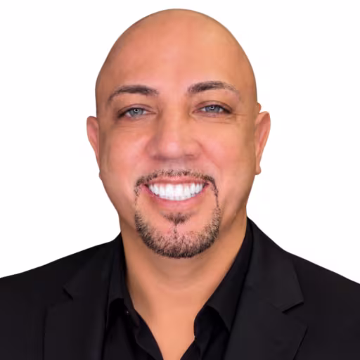 Headshot for Angel Rabago, wearing a black shirt
