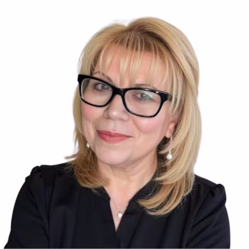 headshot of Elsie Labiosa, wearing a black shirt and black glasses