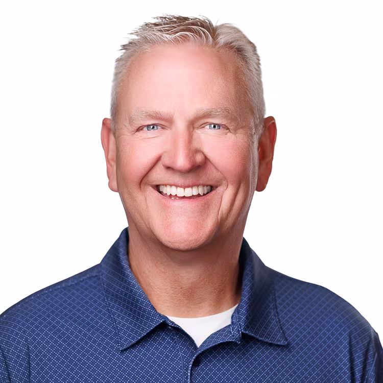 headshot of Novus' National Sales Director Brian Jensen, wearing a dark blue polo