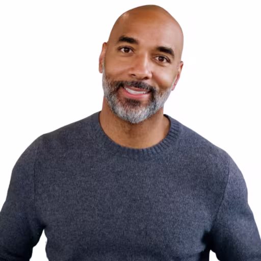 headshot of Eddie Jackson, wearing a gray sweater