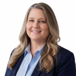 headshot of Stephanie Taylor, wearing a black blazer and light blue shirt